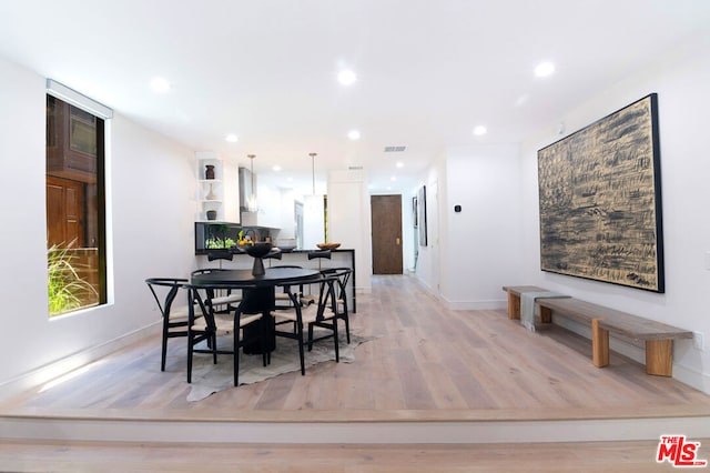 dining area featuring light wood-type flooring