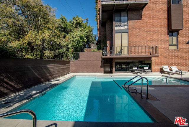 view of pool with a patio