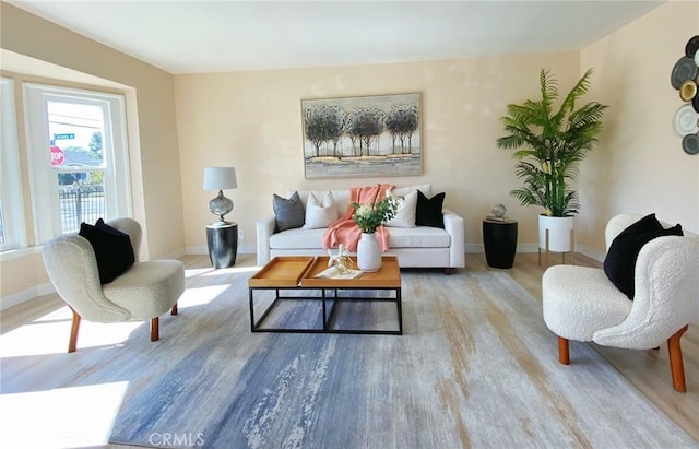 living area with hardwood / wood-style flooring