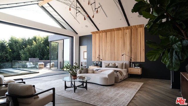 living room with high vaulted ceiling and dark parquet floors