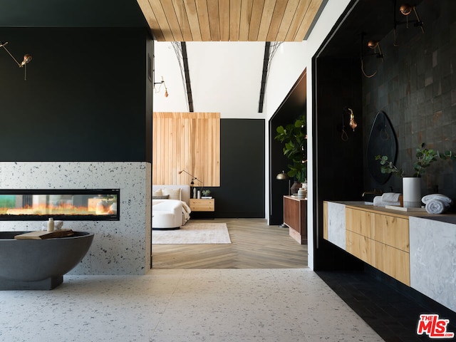 bathroom featuring vanity and a tub