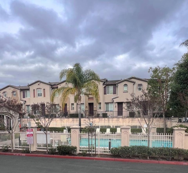 view of property featuring a community pool