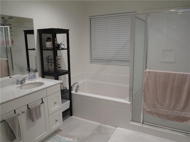 bathroom with vanity, tile patterned flooring, and plus walk in shower