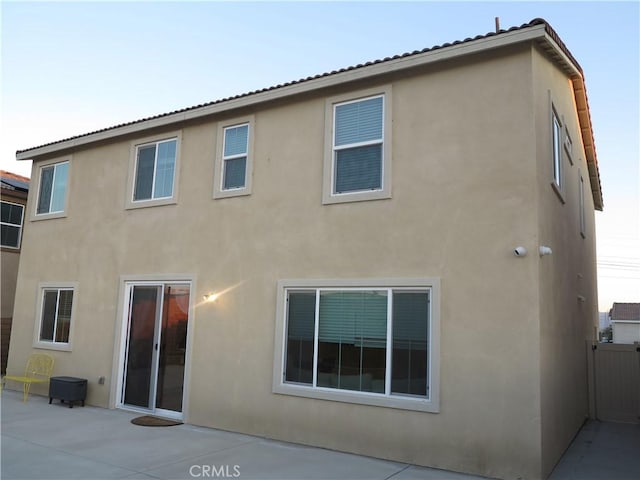 rear view of property with a patio area