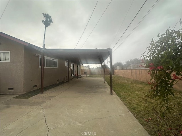 view of patio / terrace featuring a carport