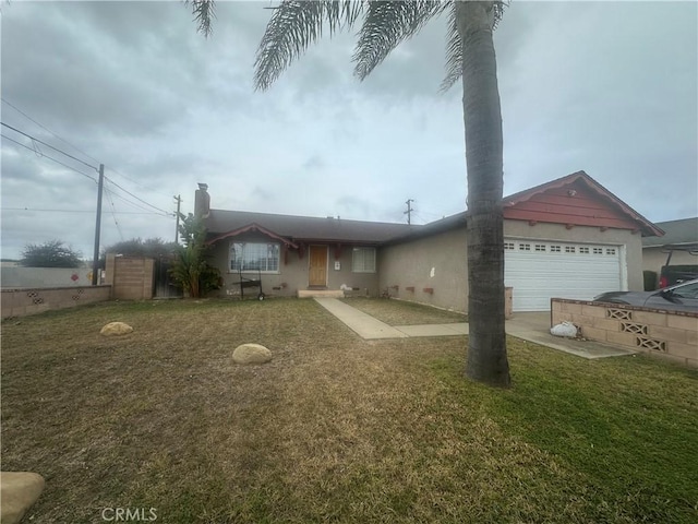 view of front of property featuring a garage and a front yard