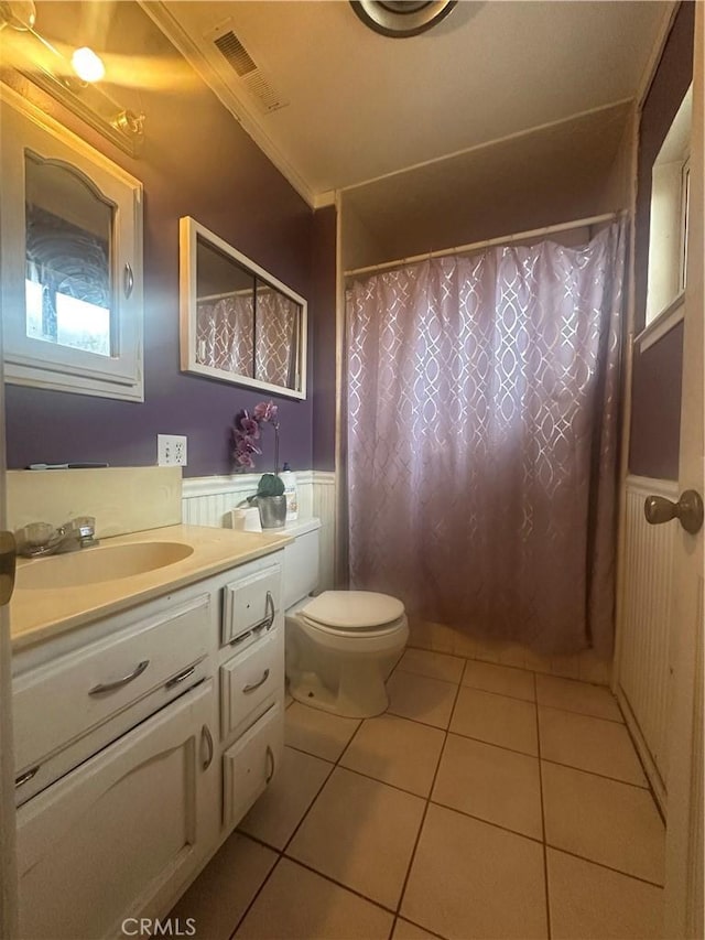 bathroom featuring crown molding, tile patterned floors, vanity, and toilet