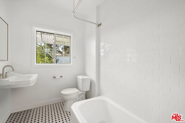 bathroom with shower / bathtub combination and toilet