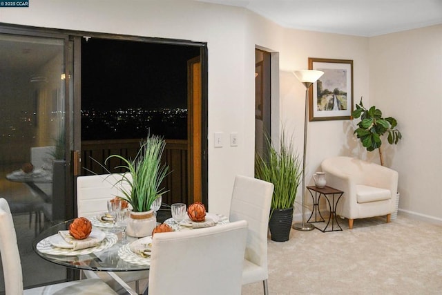 dining room featuring carpet flooring