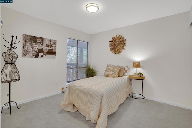 carpeted bedroom with baseboard heating