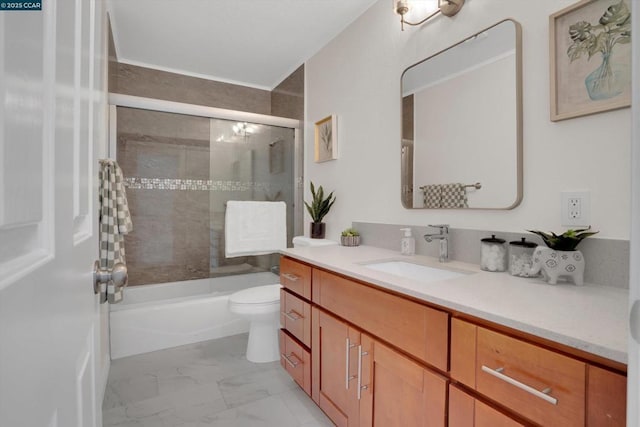 full bathroom with vanity, toilet, and combined bath / shower with glass door