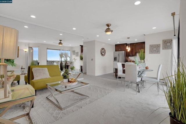 living room with light carpet and ceiling fan