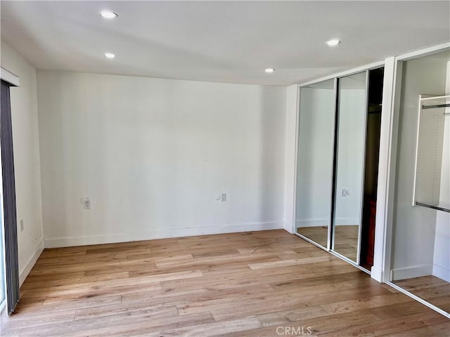 unfurnished bedroom with light hardwood / wood-style flooring