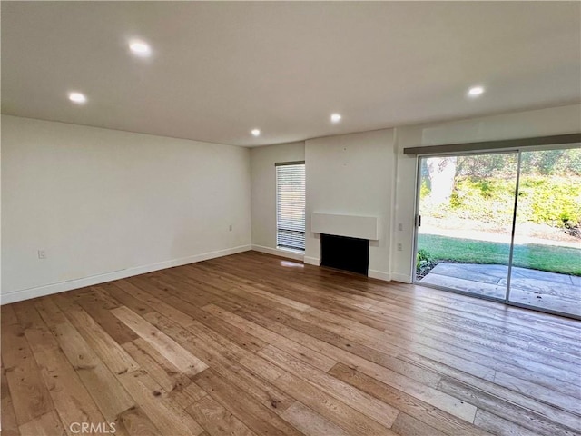 unfurnished living room with light hardwood / wood-style flooring