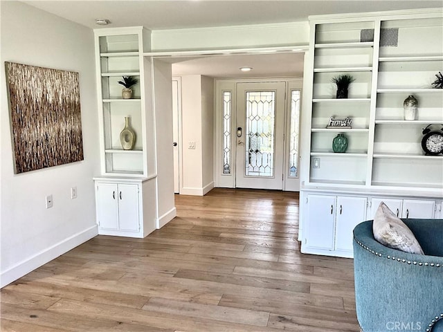 interior space featuring hardwood / wood-style flooring and baseboards