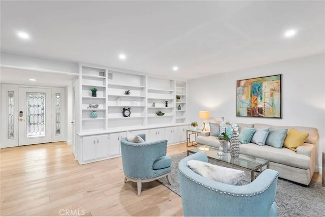 living room with light wood-style flooring and recessed lighting