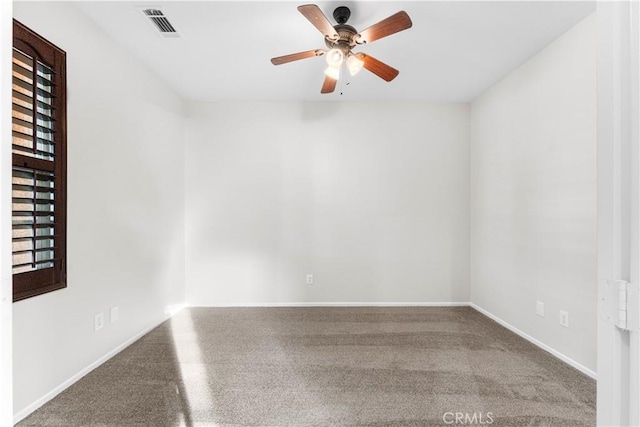 spare room with carpet flooring and ceiling fan