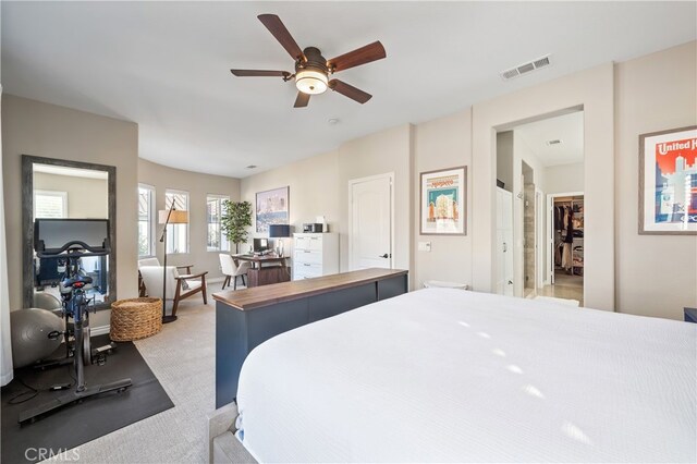 bedroom featuring light colored carpet and ceiling fan