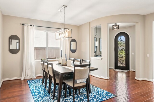 dining room with dark hardwood / wood-style flooring