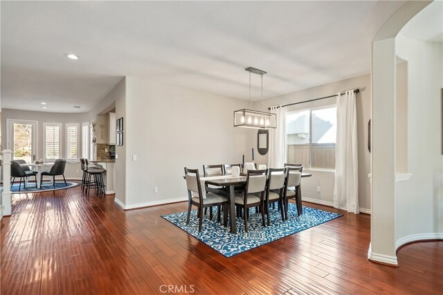 dining room with dark wood-type flooring