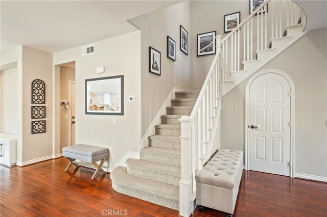 stairs with hardwood / wood-style flooring