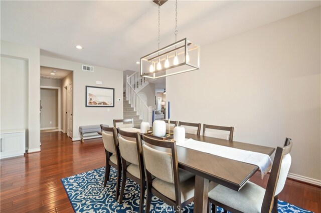 dining space with dark hardwood / wood-style floors