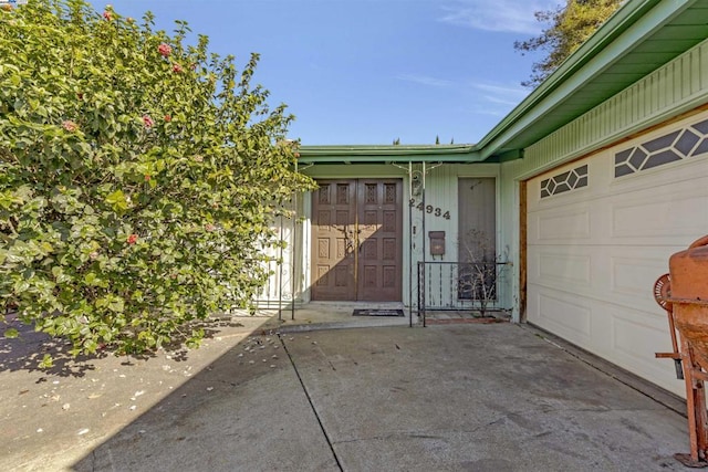 view of exterior entry with a garage