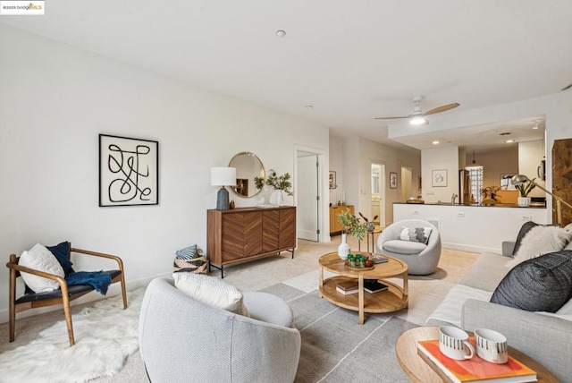 carpeted living room featuring ceiling fan