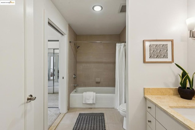 full bathroom with shower / bath combination with curtain, vanity, tile patterned floors, and toilet