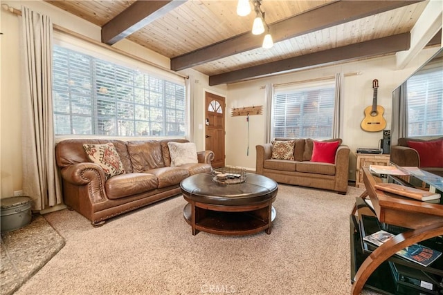 carpeted living room with beam ceiling and wooden ceiling