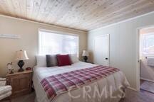 bedroom featuring ornamental molding and wooden ceiling