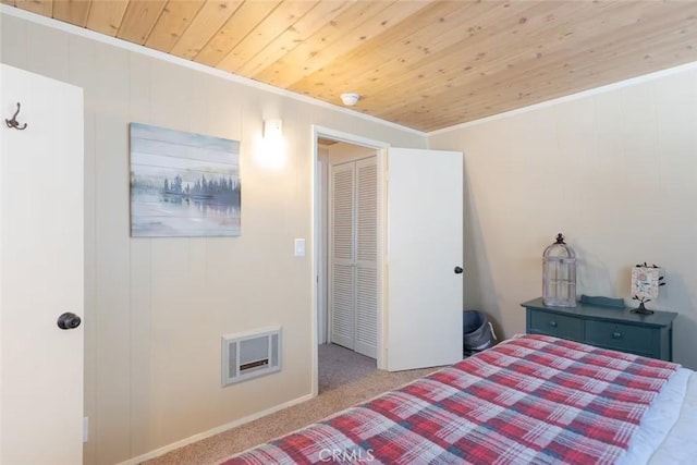 carpeted bedroom with crown molding and wooden ceiling