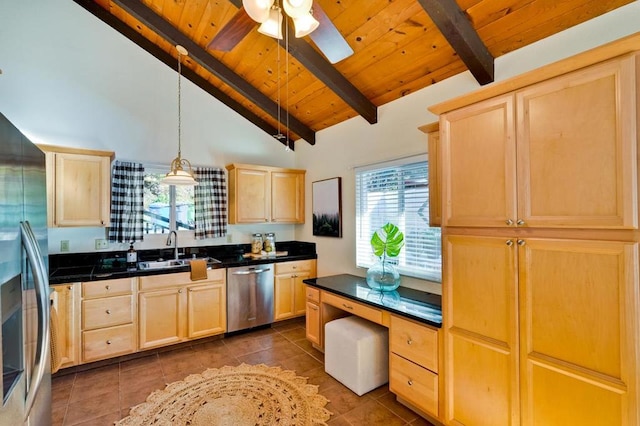 kitchen featuring sink, appliances with stainless steel finishes, a wealth of natural light, lofted ceiling with beams, and light brown cabinetry