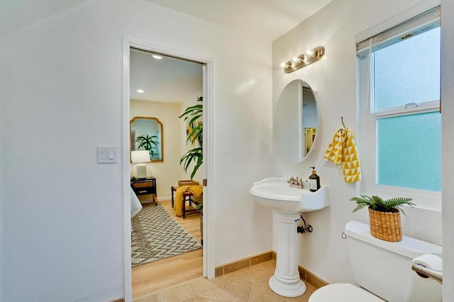 bathroom featuring tile patterned floors and toilet