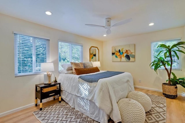 bedroom featuring ceiling fan and light hardwood / wood-style flooring