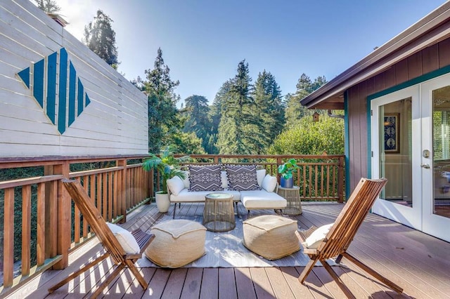 wooden terrace featuring an outdoor hangout area