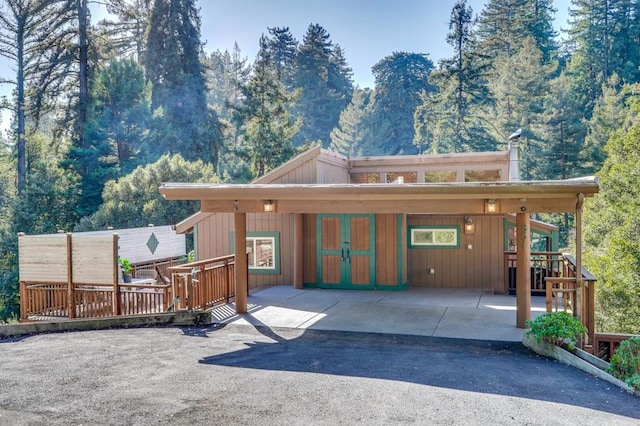 view of front of home with a deck with mountain view