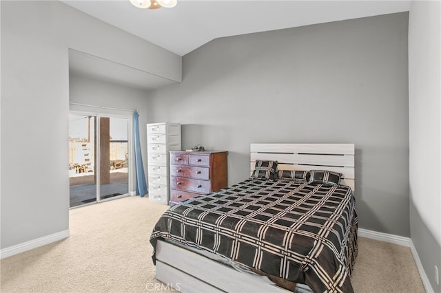 carpeted bedroom featuring lofted ceiling and access to outside