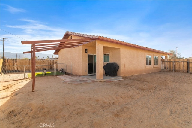 rear view of house featuring a patio