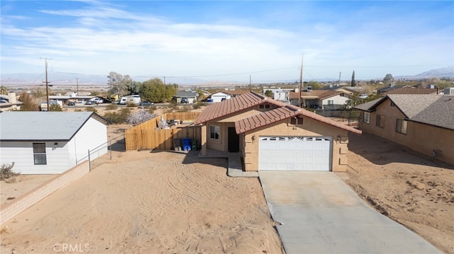 view of front of property with a garage