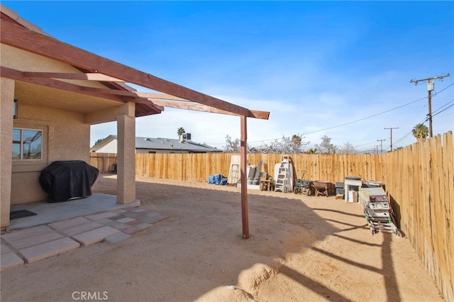 view of patio with a grill