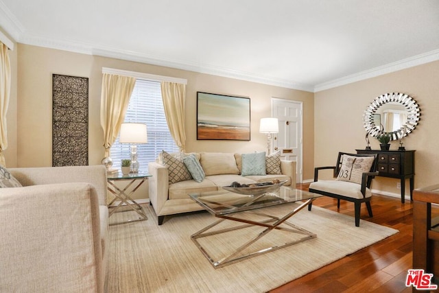 living room featuring hardwood / wood-style flooring and ornamental molding