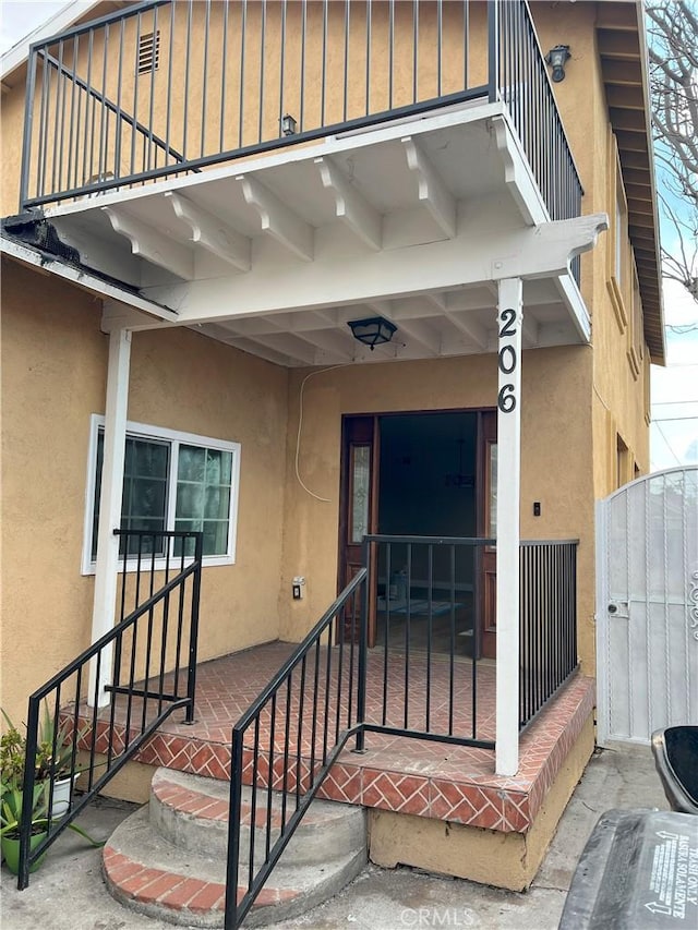 doorway to property with a balcony