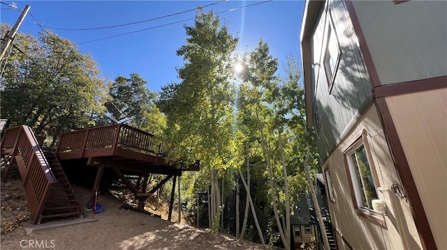 exterior space with stairs and a deck