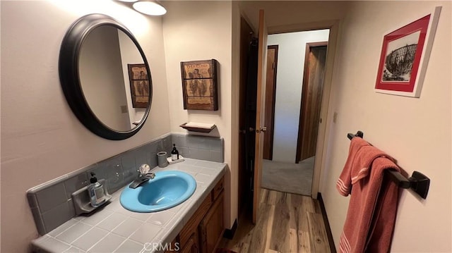 bathroom with vanity and wood finished floors