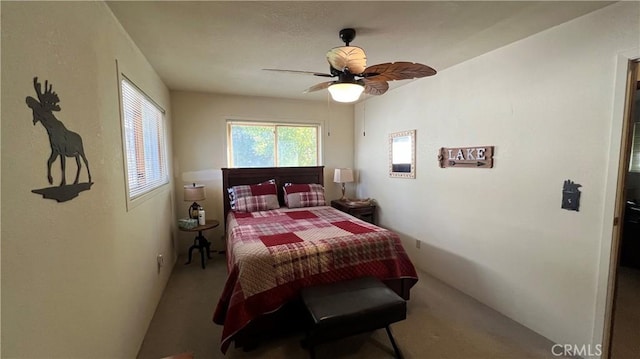 carpeted bedroom with a ceiling fan