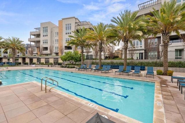 view of swimming pool featuring a patio area