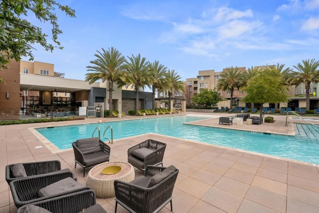 view of pool featuring a patio area