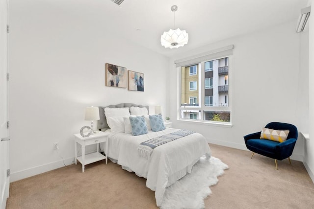 bedroom with light carpet