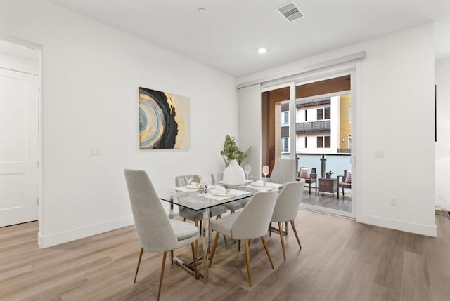 dining room with light wood-type flooring